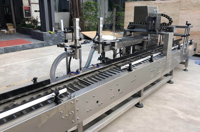 mesin penutup ember pengisian oli.jpg