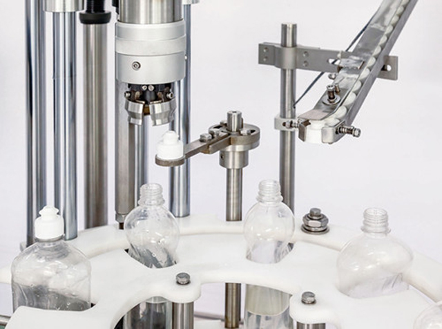 capping head close shot detail mesin penutup tunggal.jpg