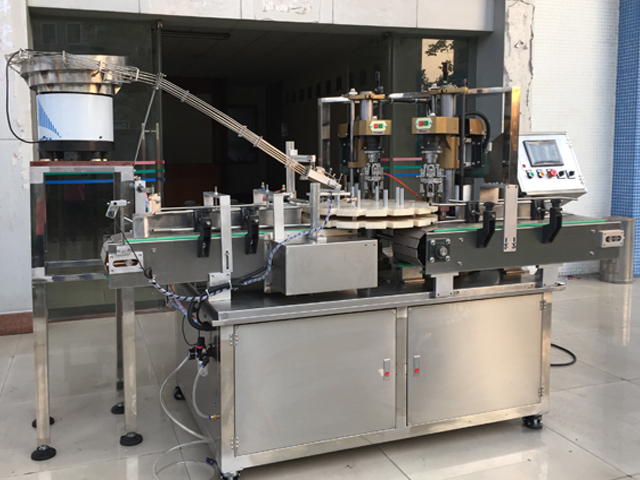 capping machine with 2 capping heads peralatan penutup sekrup semi otomatis.jpg