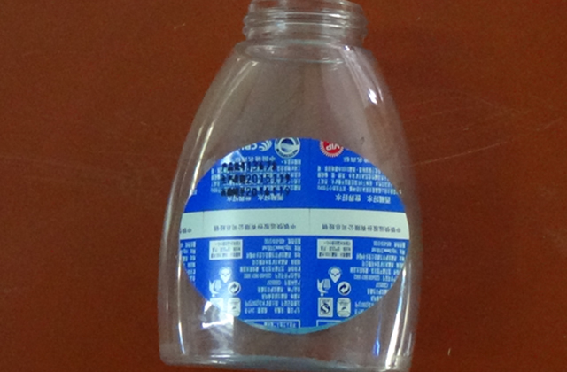 mesin pelabelan bergulir untuk sampel botol pipih.jpg