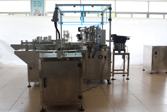 mesin pengisian dan penutup minyak atsiri.jpg