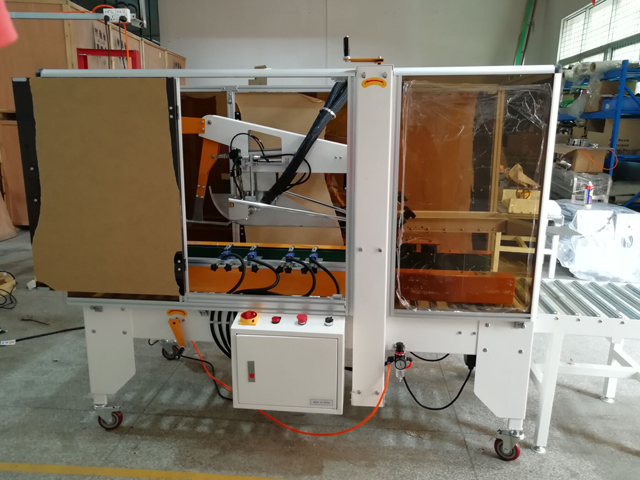 penyegel karton dengan alat lem panas meleleh (1).jpg